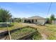Spacious backyard with a small garden, patio, and room for entertaining at 3342 Sanborn Ln, Deltona, FL 32738