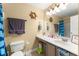 Nautical-themed bathroom featuring a large mirror and ample counter space at 3342 Sanborn Ln, Deltona, FL 32738
