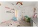 Cozy bedroom with plush carpet, and decorative shelving providing ample space for storage and display at 3342 Sanborn Ln, Deltona, FL 32738