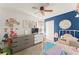 Comfortable bedroom with decorative wall art, carpet floors, and closet at 3342 Sanborn Ln, Deltona, FL 32738