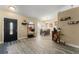 Inviting foyer with wood-look tile flooring, leading to the dining area at 3342 Sanborn Ln, Deltona, FL 32738