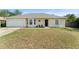 Charming single-story home with a well-maintained lawn and attached two-car garage at 3342 Sanborn Ln, Deltona, FL 32738