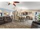 Open floor plan features tile floors and flows into kitchen with seating at counter at 3342 Sanborn Ln, Deltona, FL 32738