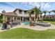 Expansive backyard with a large pool, spa, lush landscaping, and multiple seating areas at 4031 Bermuda Grove Pl, Longwood, FL 32779