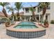 Backyard boasts a pool and spa surrounded by mature landscaping, creating a private oasis at 4031 Bermuda Grove Pl, Longwood, FL 32779