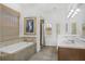 Bathroom featuring a soaking tub, walk-in shower, and double vanity sinks at 4031 Bermuda Grove Pl, Longwood, FL 32779