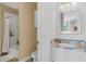 Cozy bathroom featuring a bathtub with shower and a vanity sink with colorful tiles at 4031 Bermuda Grove Pl, Longwood, FL 32779