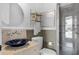 Bathroom with vessel sink, mosaic tile wall, and glass enclosed shower at 4031 Bermuda Grove Pl, Longwood, FL 32779