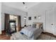 Bedroom with a treadmill and access to the pool area at 4031 Bermuda Grove Pl, Longwood, FL 32779
