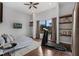 Bedroom includes a treadmill and views of the pond at 4031 Bermuda Grove Pl, Longwood, FL 32779