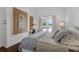 Bright bedroom with white walls, dark wood floors, and access to the pool at 4031 Bermuda Grove Pl, Longwood, FL 32779