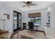 Well-appointed home office with lake views, wood floors, and custom built-ins at 4031 Bermuda Grove Pl, Longwood, FL 32779
