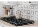 Close-up of the gourmet kitchen featuring a gas cooktop and stylish patterned tile backsplash at 4031 Bermuda Grove Pl, Longwood, FL 32779