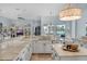 Gourmet kitchen featuring an island, sleek countertops, and a sunlit breakfast nook overlooking the pool at 4031 Bermuda Grove Pl, Longwood, FL 32779