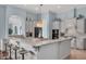Spacious kitchen with pendant lighting, large island, breakfast bar and stainless steel appliances at 4031 Bermuda Grove Pl, Longwood, FL 32779