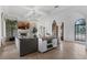Inviting living room showcases a stone fireplace, built-in shelving, and modern furnishings for relaxation at 4031 Bermuda Grove Pl, Longwood, FL 32779