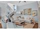 Bright, airy living room featuring a staircase, light walls, and comfortable furniture at 4031 Bermuda Grove Pl, Longwood, FL 32779