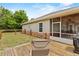 Backyard with a view of the rear screened porch and wooden deck at 41128 Apple St, Eustis, FL 32736