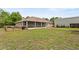 Spacious backyard with a screened porch and an outbuilding that creates a relaxing outdoor area at 41128 Apple St, Eustis, FL 32736