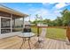 Backyard with a wood deck and green yard with shed at 41128 Apple St, Eustis, FL 32736