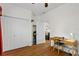 Bedroom featuring hardwood floors, a desk, a double door closet, and an open doorway at 41128 Apple St, Eustis, FL 32736