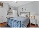 Bedroom with blue bedding, wood floor, closet, nightstand and decorations at 41128 Apple St, Eustis, FL 32736
