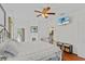 Spacious bedroom featuring a ceiling fan, tv, and a view to the pool at 41128 Apple St, Eustis, FL 32736