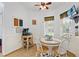 Cozy breakfast nook featuring a round table, white chairs, and a ceiling fan for comfortable dining at 41128 Apple St, Eustis, FL 32736