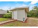 Outbuilding with neutral color with stone walkway and a grassy lawn adds character to this home at 41128 Apple St, Eustis, FL 32736