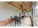 Screened porch with wooden ceiling and outdoor seating at 41128 Apple St, Eustis, FL 32736