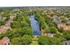 Expansive aerial view of the river and community featuring lush mature landscaping at 4284 New Broad St # 102, Orlando, FL 32814