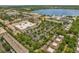 Aerial view of the community shopping center with a grocery store and plenty of parking at 4284 New Broad St # 102, Orlando, FL 32814
