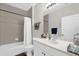 Well-lit bathroom featuring a shower-tub combo, a white vanity, and modern fixtures at 4284 New Broad St # 102, Orlando, FL 32814