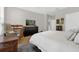Spacious bedroom featuring a dark wood dresser and hardwood floors at 4284 New Broad St # 102, Orlando, FL 32814