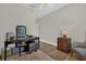 Inviting bedroom with hardwood floors, a ceiling fan, and ample space for relaxation and work at 4284 New Broad St # 102, Orlando, FL 32814