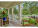 Inviting front porch with wicker furniture and a tranquil outdoor view at 4284 New Broad St # 102, Orlando, FL 32814