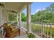 Inviting front porch with wicker furniture and a tranquil outdoor view at 4284 New Broad St # 102, Orlando, FL 32814