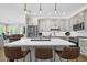 Modern kitchen with a large center island, pendant lighting, and stainless steel appliances at 4284 New Broad St # 102, Orlando, FL 32814
