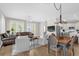 Open-concept living space with combined living, dining, and kitchen areas at 4284 New Broad St # 102, Orlando, FL 32814