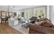Spacious and inviting living area with hardwood floors and natural light at 4284 New Broad St # 102, Orlando, FL 32814