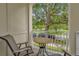 Charming patio area with comfortable seating overlooking the well-maintained front yard at 4284 New Broad St # 102, Orlando, FL 32814
