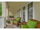 Inviting outdoor sitting area on the porch with comfortable chairs and natural light at 4284 New Broad St # 102, Orlando, FL 32814