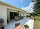 Covered patio with outdoor seating, perfect for entertaining and relaxation in a private backyard at 541 Kistler Cir, Clermont, FL 34715