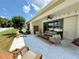 Covered patio with outdoor seating, perfect for entertaining and relaxation in a private backyard at 541 Kistler Cir, Clermont, FL 34715