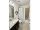 Bathroom featuring a single vanity, tile floors, and a shower/tub combo with curtain at 541 Kistler Cir, Clermont, FL 34715