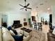 Open concept living room with seamless flow to the kitchen, perfect for modern living and entertaining at 541 Kistler Cir, Clermont, FL 34715