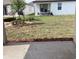 Backyard showing grass and the side of a home, captured from the porch at 5733 Haystack Drive, St Cloud, FL 34771
