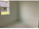 A bright bedroom with a window view overlooking the backyard and the new homes being built next door at 5733 Haystack Drive, St Cloud, FL 34771