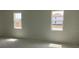 Bright bedroom with two windows overlooking the new homes being built next door at 5733 Haystack Drive, St Cloud, FL 34771