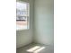 A bright bedroom with a window view overlooking the new homes being built next door at 5733 Haystack Drive, St Cloud, FL 34771